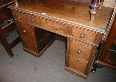 Lot 523 - Early 20th century oak pedestal desk