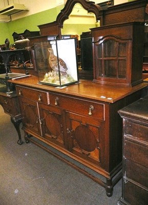 Lot 543 - Circa 1920's carved oak mirror backed sideboard