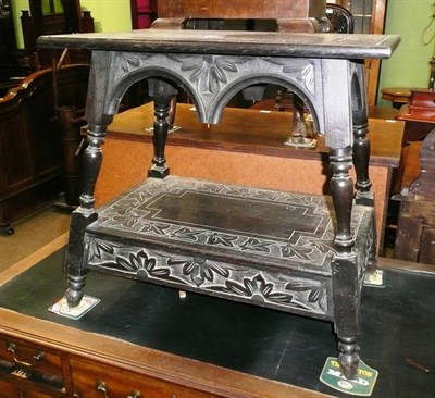 Lot 546 - Carved oak two tier table