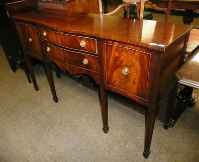 Lot 549 - A reproduction mahogany serpentine fronted sideboard