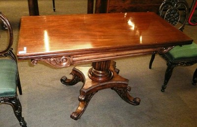 Lot 561 - A mahogany fold over card table, circa 1830, with column frieze flanked by scrolling leaf...