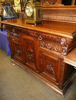 Lot 627 - A late Victorian carved oak side board