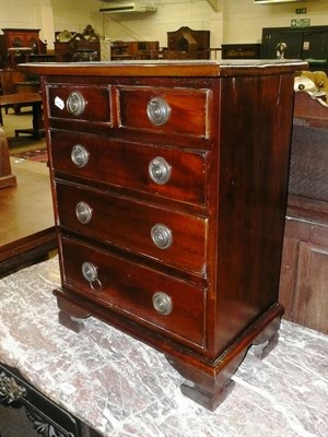 Lot 628 - A small reproduction chest of small drawers