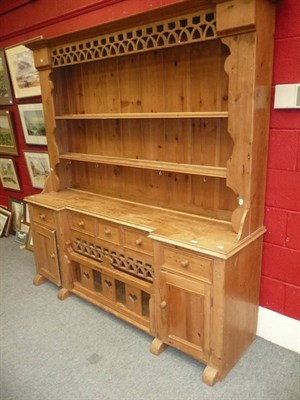 Lot 650 - A large 19th century 'Irish hen coop' pine dresser and rack with carved detailing