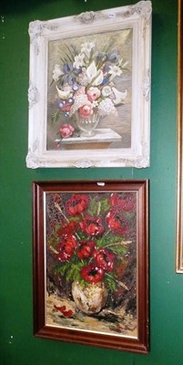 Lot 694 - Framed oil figures in a street signed Wainwright, and two oils still life's of flowers (3)