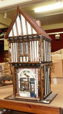 Lot 707 - Modern Tudor-style music shop by Roy Williams