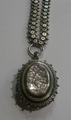 Lot 8 - A Victorian silver locket on chain
