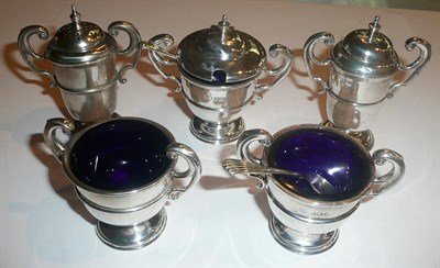 Lot 16 - A silver trophy-shaped five piece cruet