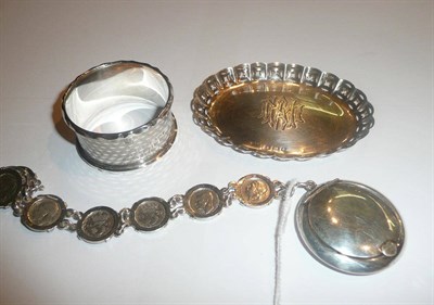 Lot 32 - An Edwardian small silver pin dish, a silver compact, a silver napkin ring and a silver...