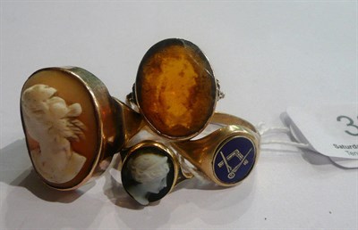 Lot 38 - A 9ct gold Masonic ring, a 9ct gold cameo ring, a cameo ring stamped '9CT' and a citrine ring (4)