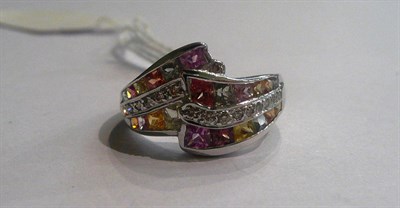 Lot 39 - A 9ct white gold ring set with multi coloured sapphires and diamonds