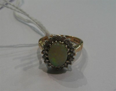 Lot 47 - A 9ct gold opal and diamond cluster ring