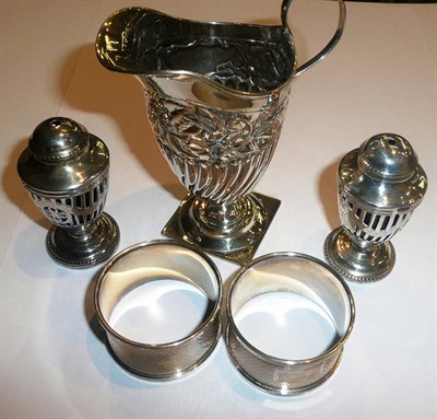 Lot 56 - A Victorian silver cream helmet, two napkin rings and two salts