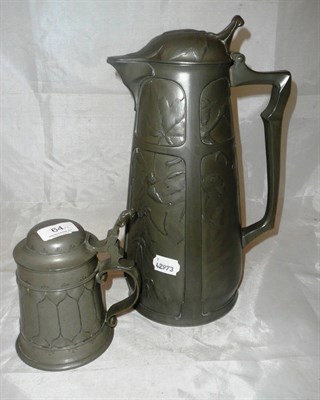 Lot 64 - German pewter lidded beer jug and a similar tankard