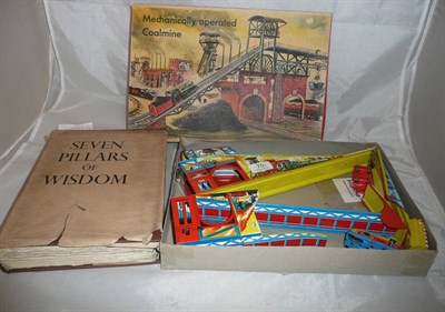 Lot 70 - A boxed Technoflix 'Mechanically Operated Coalmine' tinplate toy and a book 'Seven Pillars of...