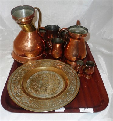 Lot 87 - A quantity of Victorian and later copper measures and a Chinese brass dish