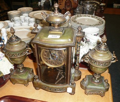 Lot 104 - Three piece gilt metal and onyx clock garniture with champleve decoration