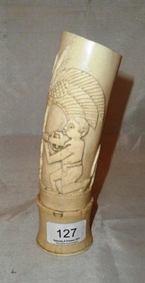 Lot 127 - An African ivory carved elephant tusk vase, early 20th century, carved with a man and rifle