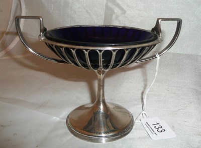 Lot 133 - A silver twin-handled pedestal bon-bon dish with blue glass liner