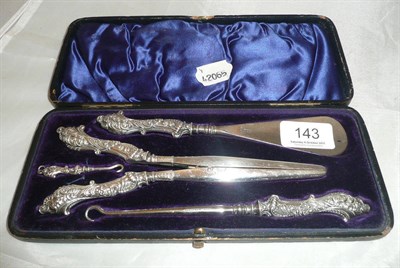 Lot 143 - Silver and steel shoe horn and glove stretcher set (boxed)