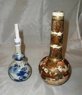 Lot 145 - A Japanese Satsuma vase and a blue and white hand decorated vase with letter re signature of maker