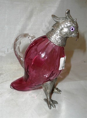 Lot 147 - A cranberry glass decanter with plated mounts in the form of a parrot