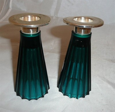 Lot 155 - A pair of WMF blue glass and plate candlesticks