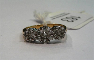 Lot 163 - An 18 carat gold ring set with diamonds in a floral design