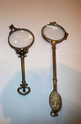 Lot 169 - A pair of yellow metal lorgnettes with ivory inset handle, and another pair