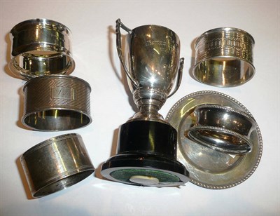 Lot 189 - Silver napkin rings, small silver pin tray and trophy cup on stand