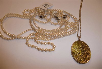 Lot 204 - 9ct gold oval locket and chain and three cultured pearl necklaces