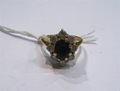 Lot 213 - An 18ct gold sapphire and diamond cluster ring