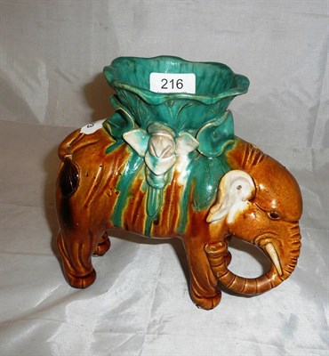 Lot 216 - A Chinese pottery 'elephant' candle vase