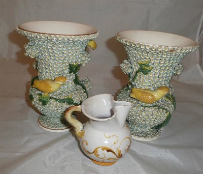 Lot 219 - A pair of porcelain Schneeballen vases mounted with canaries and a small water jug