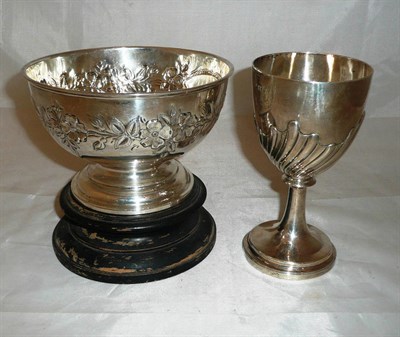 Lot 229 - A Victorian presentation silver chalice and a bowl with repousse decoration