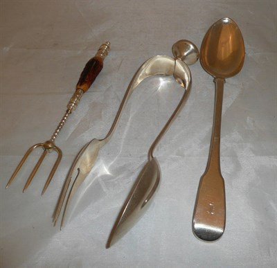 Lot 250 - A silver basting spoon, Continental white metal salad servers and a carving fork