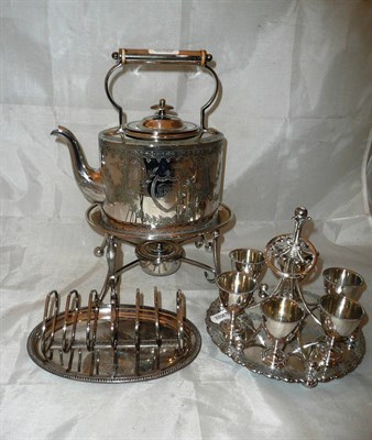 Lot 263 - A plated kettle on stand, a toast rack and an egg stand