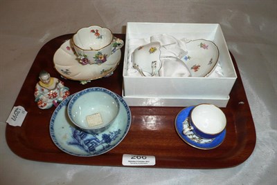 Lot 266 - A modern Meissen tea cup and saucer, boxed, a Meissen floral encrusted tea cup and saucer, a...