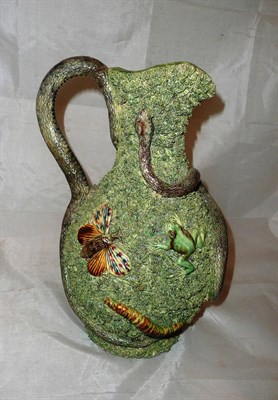 Lot 269 - A Palissy relief decorated jug