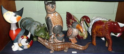 Lot 274 - A large Goebel model of a cat, no. 3717/5000, a carved stone crocodile and other carved and pottery