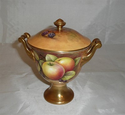 Lot 277 - A Coalport twin handled vase painted with fruit by N Lear