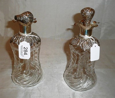 Lot 284 - Pair of glass and silver decanters with stoppers (one a.f.)