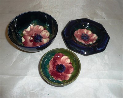 Lot 288 - A Moorcroft pin dish, ashtray and small bowl (3)