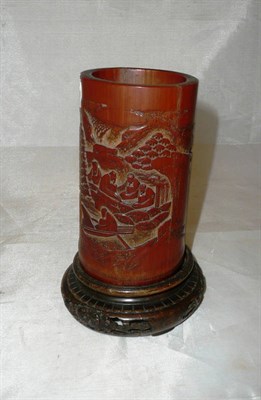 Lot 295 - A late 19th century Chinese carved bamboo brush pot on an associated Japanese wood stand