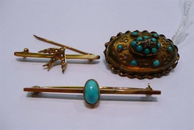 Lot 310 - A turquoise set brooch, stamped '9CT', a turquoise set brooch, stamped '15CT' and a swallow set...