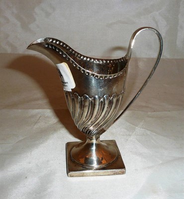 Lot 334 - Georgian silver cream jug