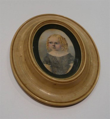 Lot 336 - A 19th century portrait miniature of a young girl, in an ivory frame