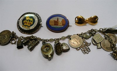 Lot 343 - Charm bracelet hung with twelve charms, a micro-mosaic brooch and a coin brooch