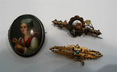 Lot 344 - Two gold brooches and an oval portrait brooch