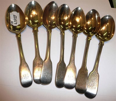 Lot 352 - Seven silver fiddle pattern dessert spoons